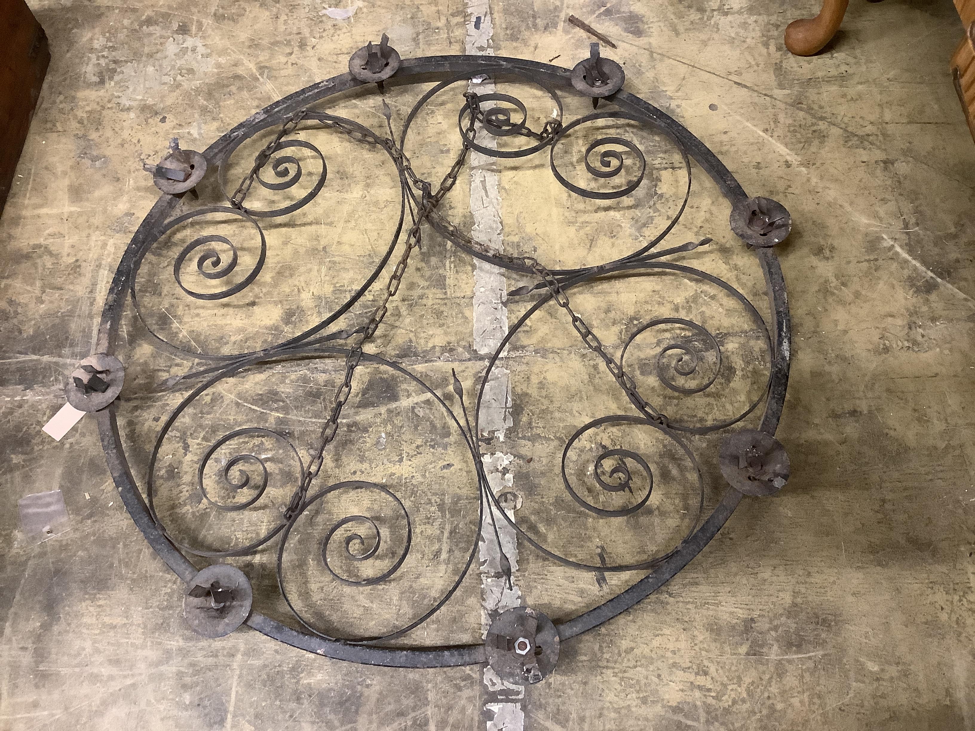 A set of three circular wrought iron hanging candle holders, diameter 95cm